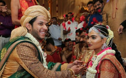 Daughter of Gali Janardhan Reddy, Bramhani (right) sits with her groom, Rajeev Reddy during their wedding at the Bangalore Palace Grounds in Bangalore. Photo: AFP/Janardhana Reddy family