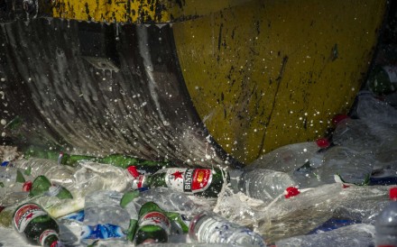 A steamroller runs over bottles of alcohol at a police station ahead of the holy month of Ramadan in Jombang, East Java, Indonesia. Photo: AFP A steamroller runs over bottles of alcohol at a police station ahead of the holy month of Ramadan in Jombang, East Java, Indonesia. Photo: AFP