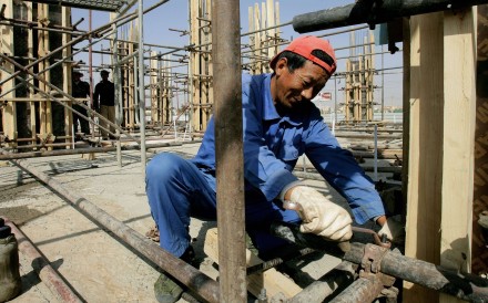 A Chinese worker fixes pipes at a construction site in Sudan’s capital Khartoum in February 2012. China is a major funder of infrastructure projects in Africa. Photo: AFP