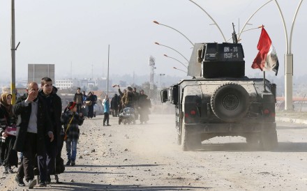 Civilians leave the city to escape from clashes. Photo: Reuters