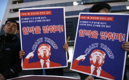South Korean protesters hold images of US President Donald Trump during a rally denouncing the United States' policy against North Korea near the US. Embassy in Seoul on Wednesday. Photo: AP South Korean protesters hold images of US President Donald Trump during a rally denouncing the United States' policy against North Korea near the US. Embassy in Seoul on Wednesday. Photo: AP