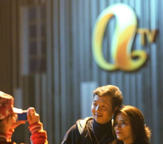 Fans take souvenir photos outside ATV’s headquarters in Tai Po. Photo: Edward Wong
