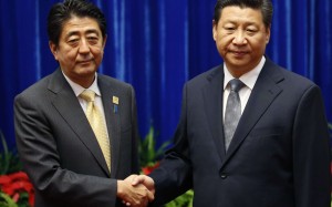 The less-than-delighted expressions on Chinese President Xi Jinping (right) and Japanese Prime Minister Shinzo Abe’s faces in this 2014 handshake underscore the uneasy relationship between the two states. Photo: Reuters