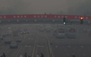 Traffic in Beijing during a particularly smoggy day, December 22, 2015. Photo: EPA