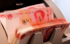 Chinese 100 yuan banknotes are seen in a counting machine at a commercial bank in Beijing. Photo: Reuters Chinese 100 yuan banknotes are seen in a counting machine at a commercial bank in Beijing. Photo: Reuters