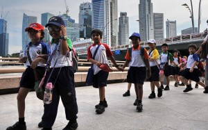 Schoolchildren in Singapore. A new study of parenting techniques in the city has discovered problems with overly intrusive parenting. Photo: AFP