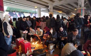 A devil-beater pounds a paper effigy with a shoe under the Canal Road flyover during the Ching Che ferstival in March 2015. Photo: Franke Tsang