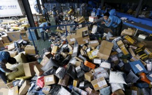 Employees work at a sorting centre of Zhongtong (ZTO) Express ahead of the Singles Day shopping festival in Beijing on November 8, 2015. Photo: Reuters Employees work at a sorting centre of Zhongtong (ZTO) Express ahead of the Singles Day shopping festival in Beijing on November 8, 2015. Photo: Reuters