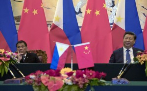 Visiting Philippine President Rodrigo Duterte and President Xi Jinping attend a signing ceremony in Beijing. Photo: AP