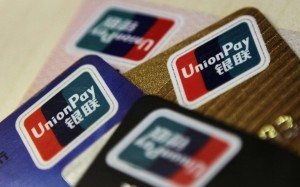 UnionPay says it will tighten regulations on how mainland customers can use its debit and credit cards to buy investment-related insurance products in Hong Kong, with immediate effect. Photo: Reuters