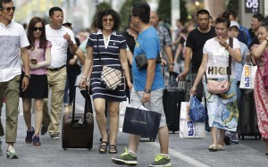 Chinese tourists to Japan seem to be shunning the usual shopping sprees to actually have fun during their trips abroad. Photo: Bloomberg