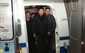 Wanted fugitive Yan Yongmin is escorted off a flight at Capital International Airport, Beijing, on Saturday. Photo: Xinhua Wanted fugitive Yan Yongmin is escorted off a flight at Capital International Airport, Beijing, on Saturday. Photo: Xinhua
