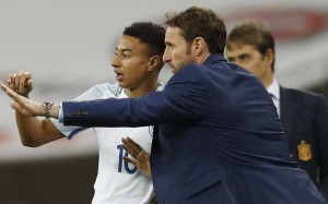 Gareth Southgate (right) with England's Jesse Lingard against Spain. Photo: Reuters