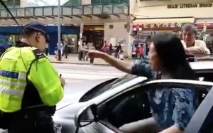 Mrs. Fung berated the policeman for nearly three minutes. Her husband had made an illegal U-turn on Des Voeux Road West, where he was promptly issued a ticket.