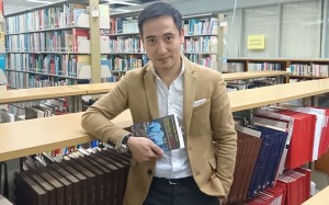 Jason Ng with a copy of his new book, Umbrellas in Bloom. Photo: Elaine Yau