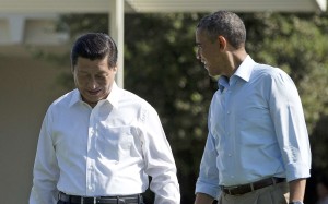Chinese President Xi Jinping, left, walks with President Barack Obama at Sunnylands estate in California in June 2013. Photo: AP
