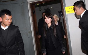 Yvonne Lui Lai-kwan (centre) who has two children with Chinese Estates chairman and chief executive Joseph Lau Luen-hung, appears at a court in Macau. The head of Chinese Estates Holdings, Joseph Lau, and Hong Kong businessman Steven Lo have both been sentenced to more than five years in prison after being convicted by a Macau court of corruption. 14MAR14