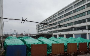 The armoured vehicles belonging to the Singapore military are seen covered with tarpaulin at a customs and excise facility in Hong Kong. Photo: AFP