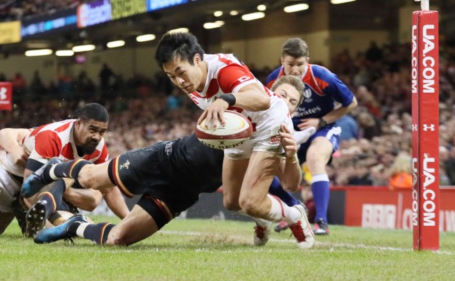 Kenki Fukuoka scores a try for Japan in the second half of their 33-30 loss to Wales at the Principality Stadium in Cardiff on Saturday. Photo: Kyodo