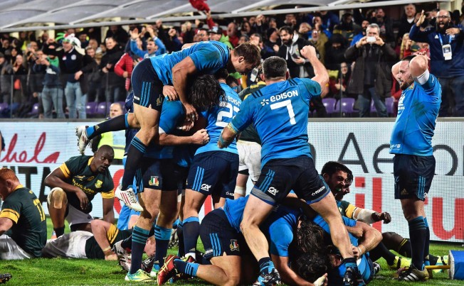 Italy celebrate posting their first ever victory over South Africa, breaking the drought with a 20-18 win in Florence on Saturday. Photo: EPA