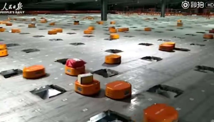 The army of little orange Hikvision robots in the sorting centre in STO Express’ delivery warehouse in Hangzhou, Zhejiang province. Photo: Handout