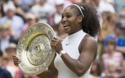 Serena Williams poses with the trophy after winning the final match against Angelique Kerber. Photo: EPA