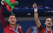 Cristiano Ronaldo and Pepe celebrate after beating France 1-0 in the Euro 2016 final in Paris. Photo: Xinhua