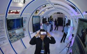 In this file photo, a visitor tries a virtual reality product during the Guiyang International Big Data Expo 2016. China is using big data to better track growth engines. Photo: Xinhua