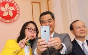 Chief Executive CY Leung takes a selfie with China Olympic swimmer Fu Yuanhui – he might have to start paying a bit more attention to sport if he runs again in 2017.