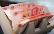 The yuan weakened to its ­lowest level in eight years against the US dollar in the onshore market on Thursday. Photo: Reuters