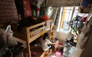 A mother and child living in one of Hong Kong’s subdivided flats in Sham Shui Po. Photo: Edward Wong