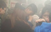 Commuters battled through choking smoke after a man lit a petrol bomb and threatened to kill passengers of the Tsuen Wan-bound train on Friday. Photo: Facebook