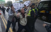 A protester objects to the conviction of the seven police officers for assaulting an Occupy protester. Photo: EPA