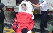 Yip Kai-foon being carried into an ambulance in 2009.