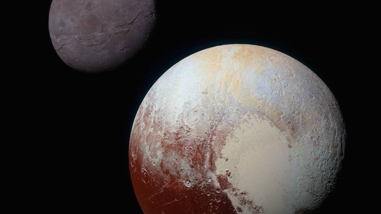 Pluto (foreground) and its moon Charon (background). NASA/JHUAPL/SwRI Pluto (foreground) and its moon Charon (background). NASA/JHUAPL/SwRI