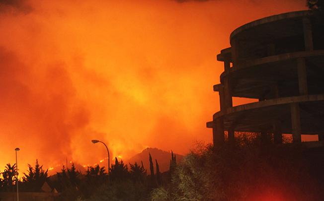 A forest fire rages on Spain's Costa del Sol near Marbella on Friday. Photo: EPA