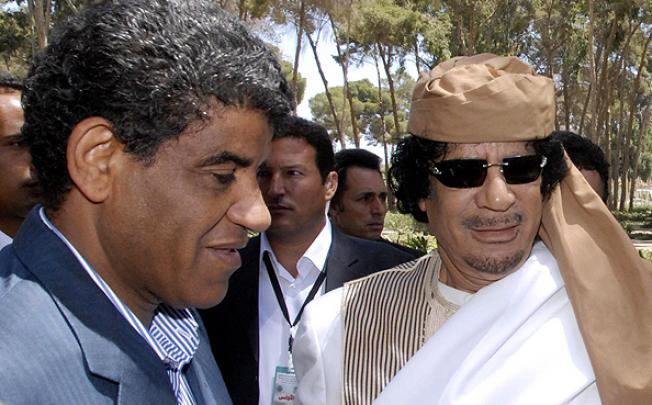 Former Libyan intelligence chief Abdullah al-Senussi (left) pictured with Muammar Gaddafi. Photo: EPA
