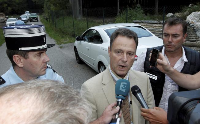 French prosecutor Eric Maillaud (centre) speaks to the media at the site where the bodies of four people in a British-registered car. Photo: EPA