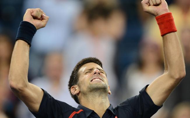 Novak Djokovic celebrates after winning against Juan Martin Del Potro during their US Open men's singles quarterfinals match on Thursday. Photo: AFP 