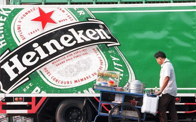 Fraser and Neave shareholders bote on proposed sale of a 40 per cent stake in Tiger beer maker Asia Pacific Breweries to Heineken later this month. Photo: AFP