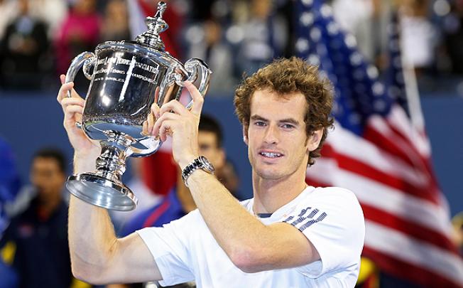 Andy Murray lifts the US Open championship trophy after defeating Novak Djokovic in the final of the US Open in New York. Photo: AFP
