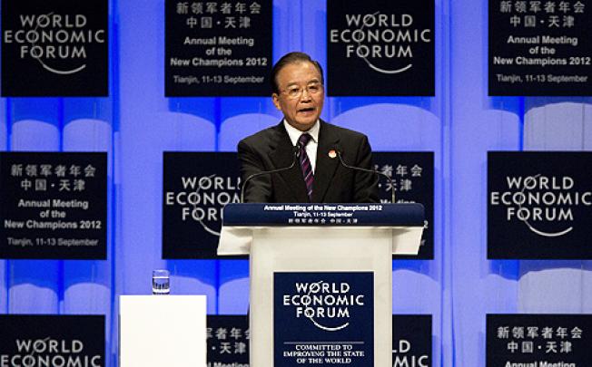 Premier Wen Jiabao speaks to the World Economic Forum in Tianjin, sounding confident of keeping the economy on a track of steady and relatively fast growth. Photo: AP