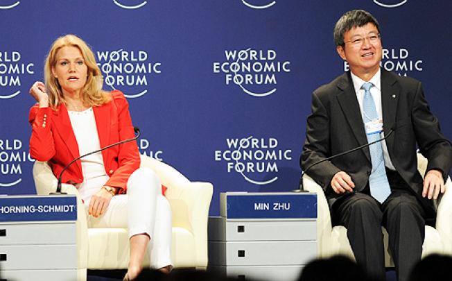 International Monetary Fund deputy managing director Zhu Min (right), with Danish Prime Minister Helle Thorning-Schmid, attends an interactive session on the European crisis at the World Economic Forum in Tianjin on Tuesday. Photo: AFP