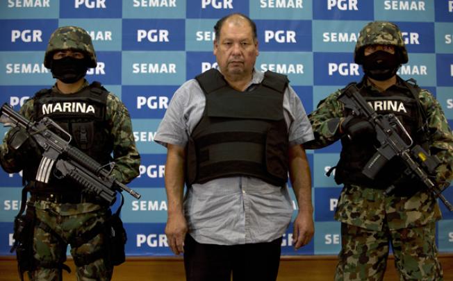 Mario Cardenas Guillen (C), alleged leader of the Gulf drug cartel, during his presentation to the press in Mexico City on September 4, 2012. Photo: AFP