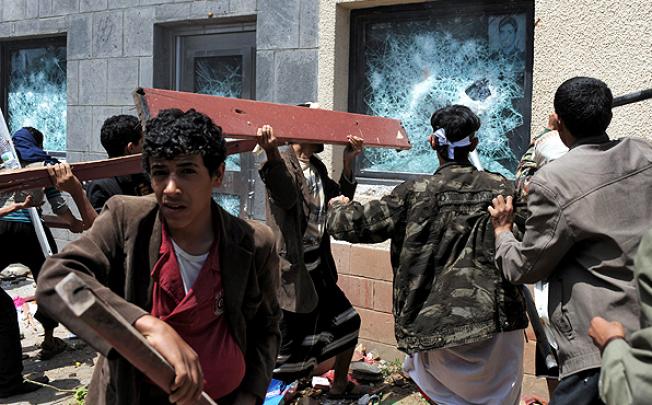 Yemeni protesters ransack the US embassy in Sanaa on Thursday. Photo: EPA