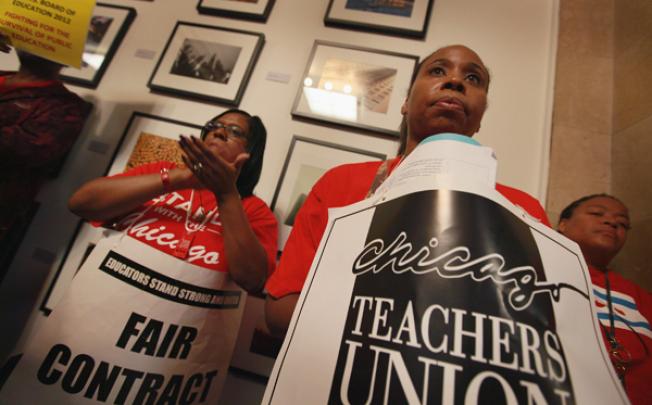 Striking Chicago public school teachers attend a press conference by The Chicago Teachers Solidarity Campaign outside the office of Mayor Rahm Emanuel in City Hall, Chicago, Illinois on Monday. Photo: AFP