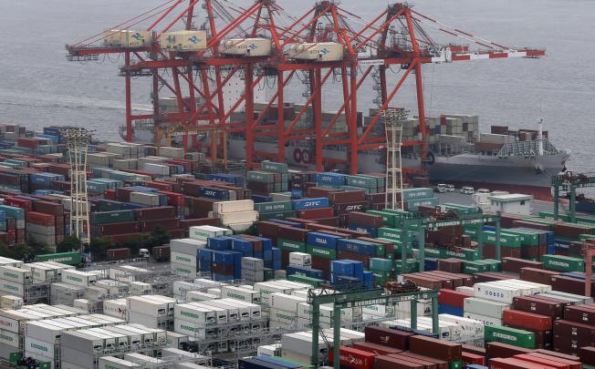 In this July 25, 2012 file photo, containers pack a container terminal at a pier in Tokyo. Photo: AP