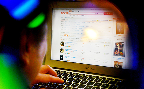 An online shopper looks for DVDs on Taobao.com, which is on a US list of “notorious markets” that sell fake goods. Photo: Thomas Yau