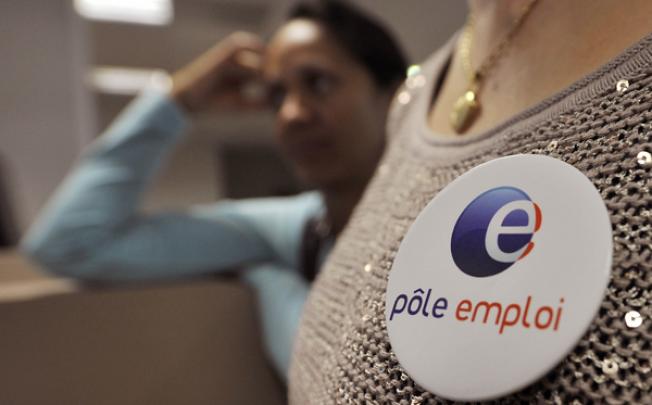 A woman waits in Pole Emploi, France's national employment agency. Photo: AFP