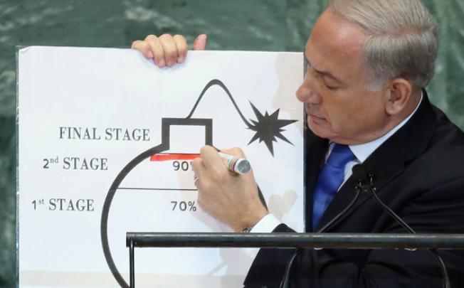 Benjamin Netanyahu, Prime Minister of Israel, draws a red line on a graphic of a bomb while discussing Iran during an address to the United Nations General Assembly on Thursday. Photo: AFP